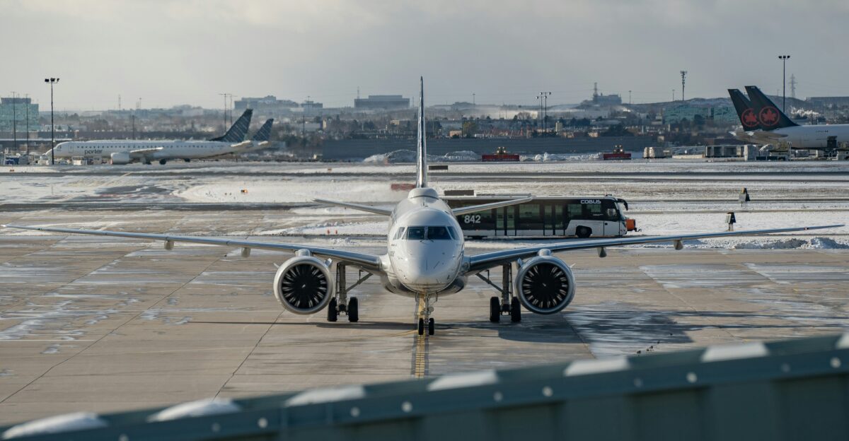 An airplane is parked on the tarmac at an airport