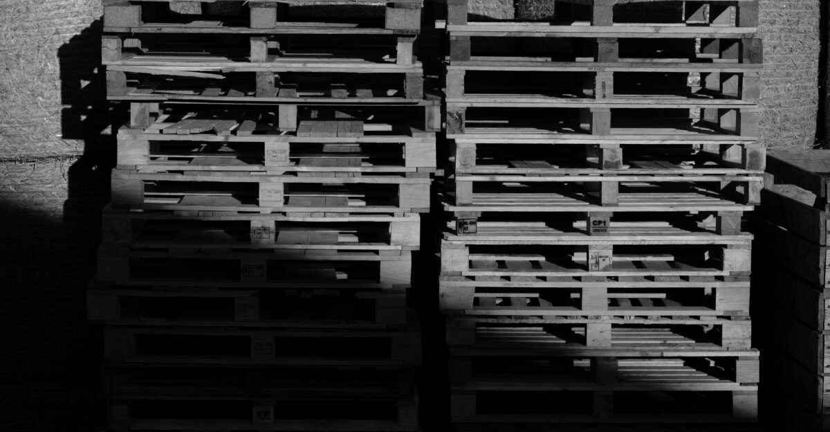 A black and white photo of a stack of crates