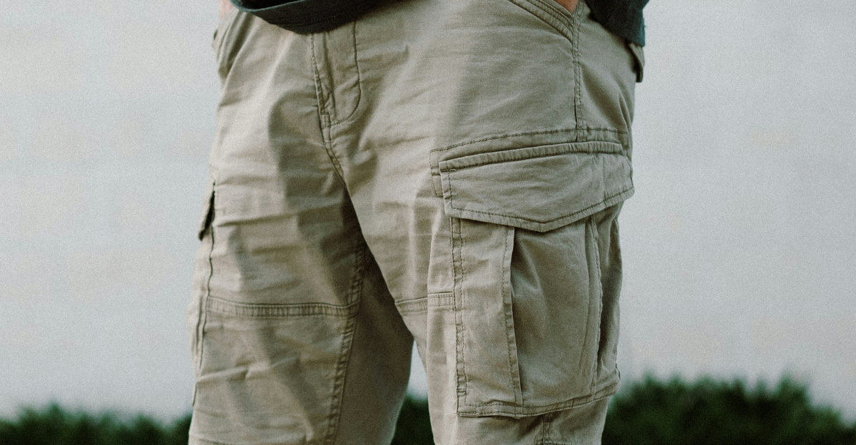 A man standing next to a swimming pool