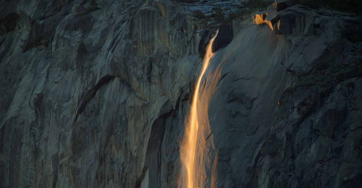 A waterfall with a light coming out of it