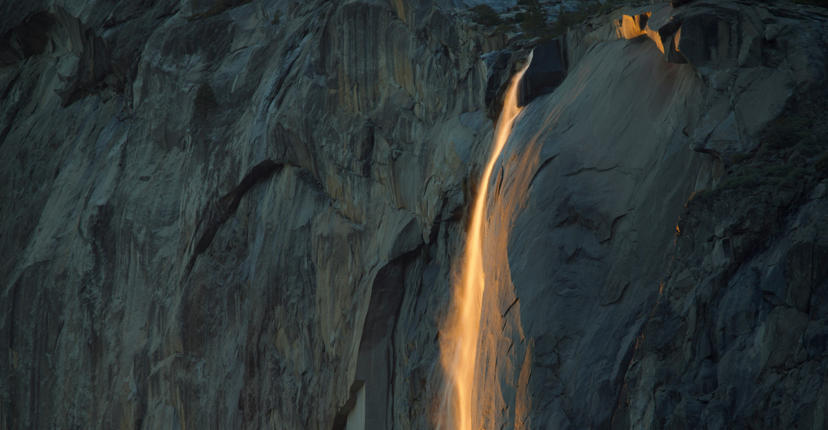 A waterfall with a light coming out of it