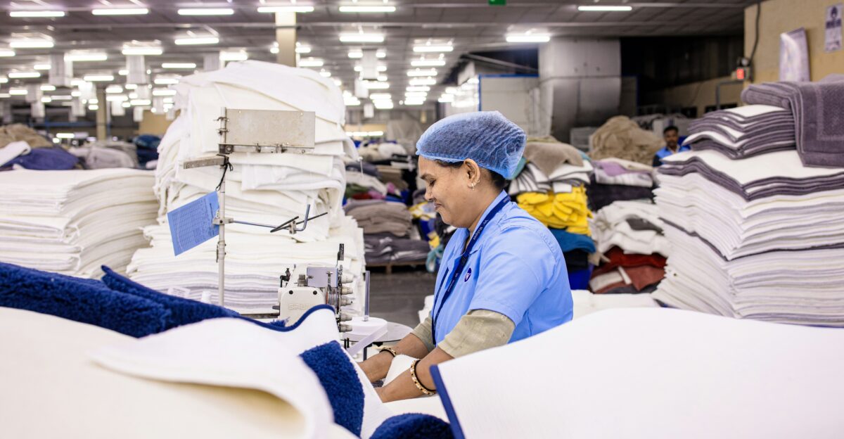 A woman works at a textile factory