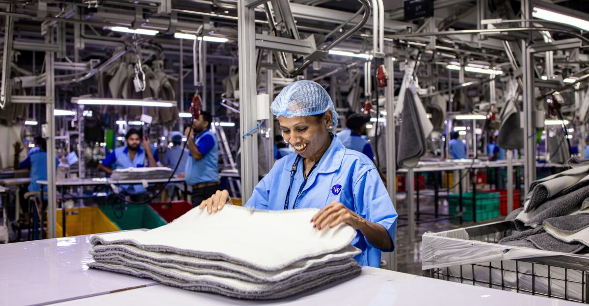 Workers are busy in an industrial clothing factory