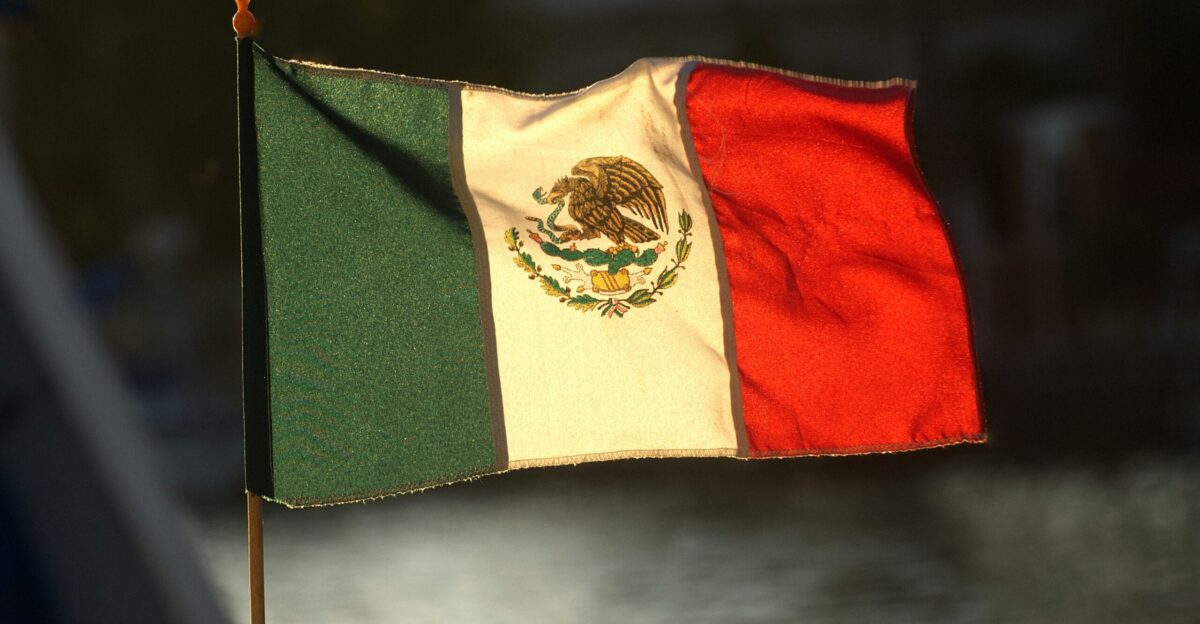 The mexican flag is waving in the wind