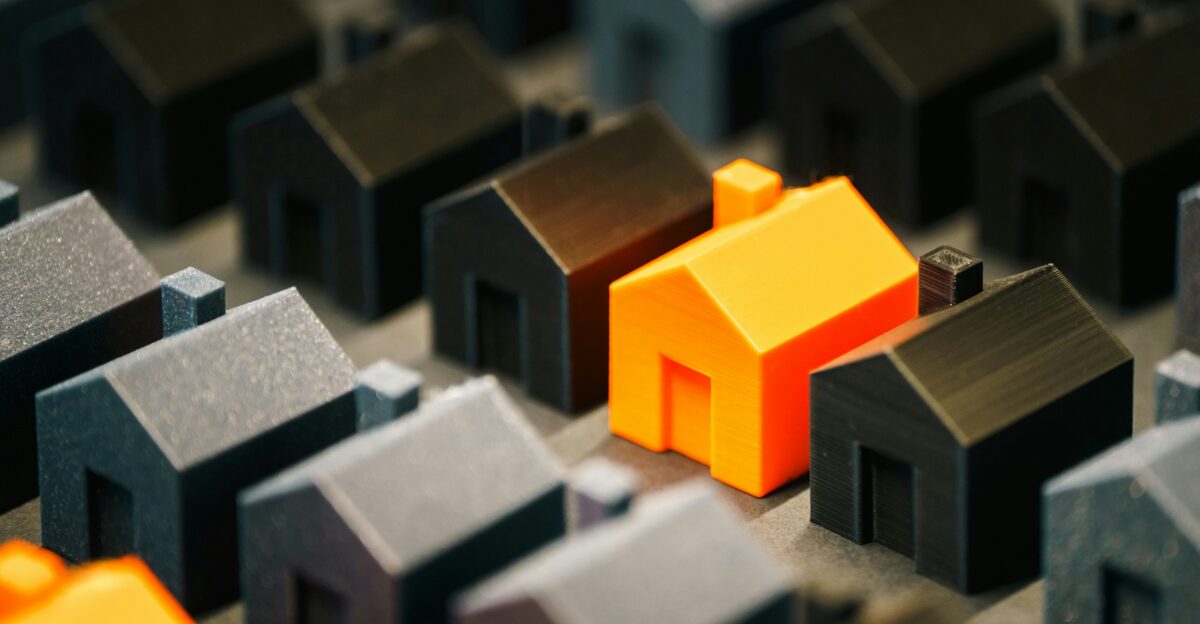 A single bright house stands out from the rest