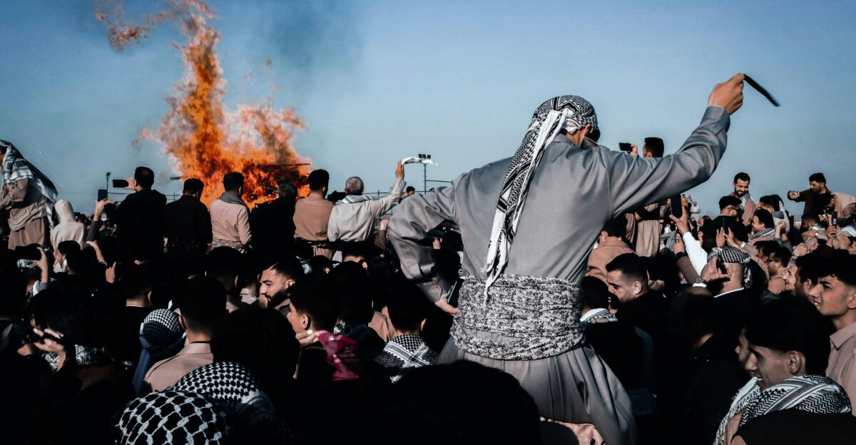 People celebrating amongst fire and celebration