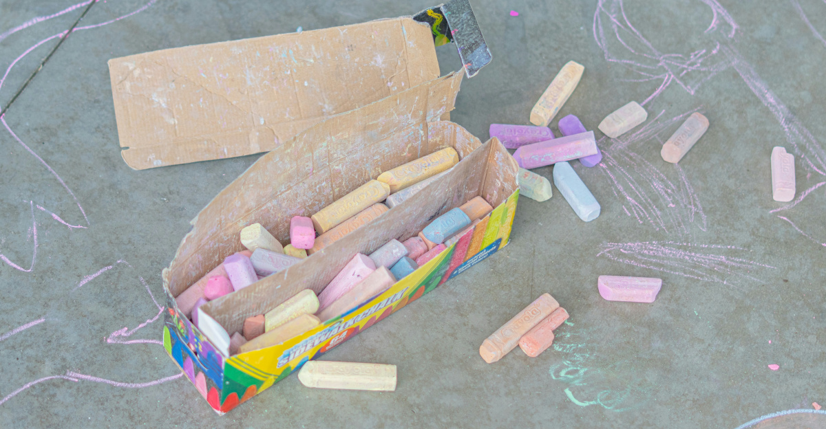 Chalk box and scattered chalk on the ground.