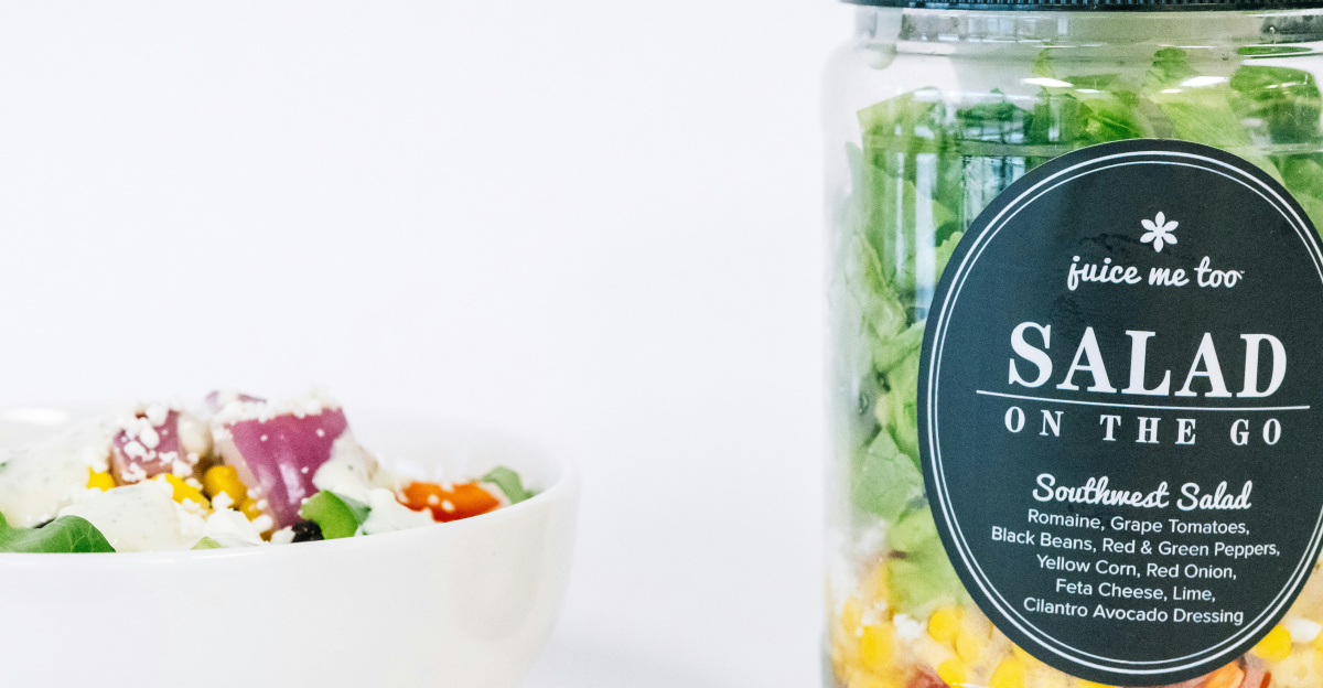 A salad-in-a-jar and a bowl of salad.
