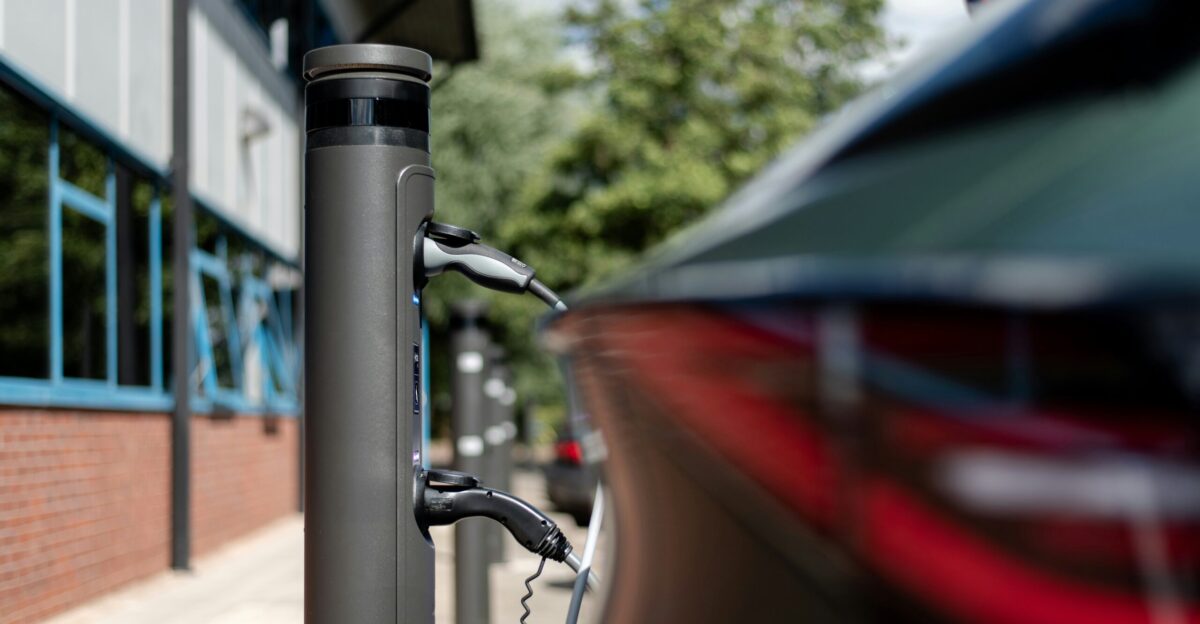An electric car is charging at a charging station