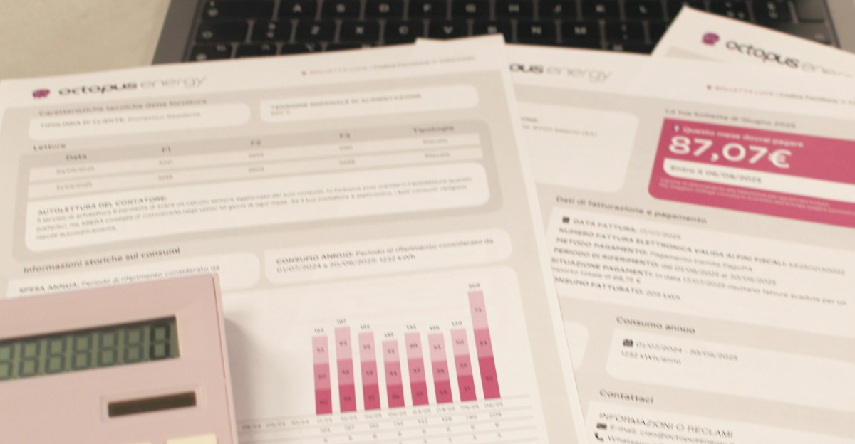 Bills, calculator, and a laptop: financial tasks underway.