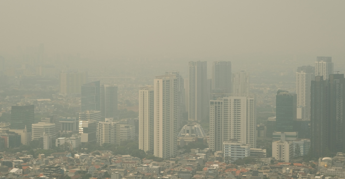 City skyline shrouded in thick smog.