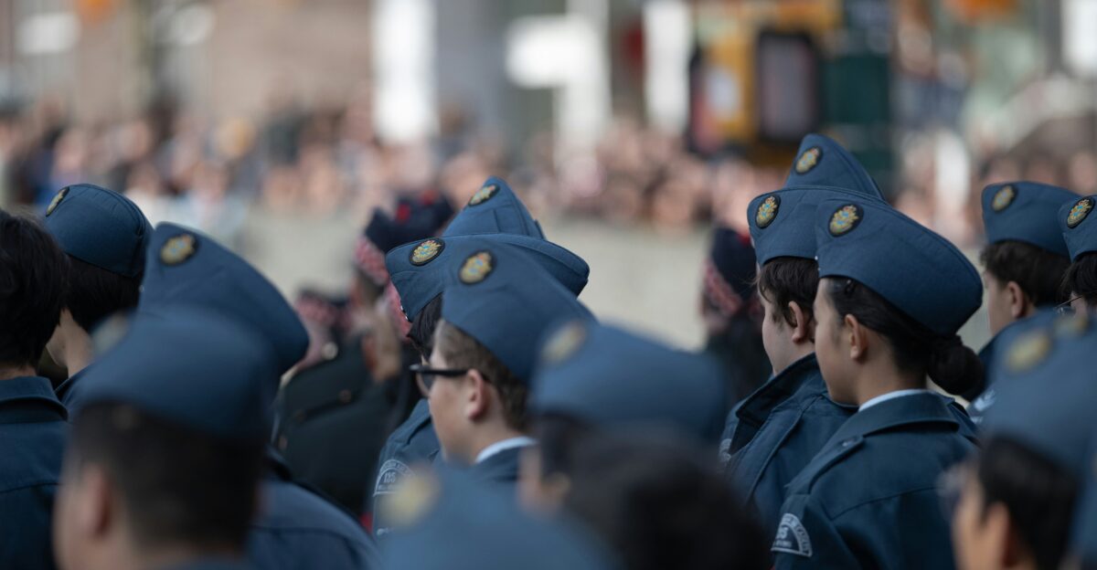 Group of people in blue hats and uniforms