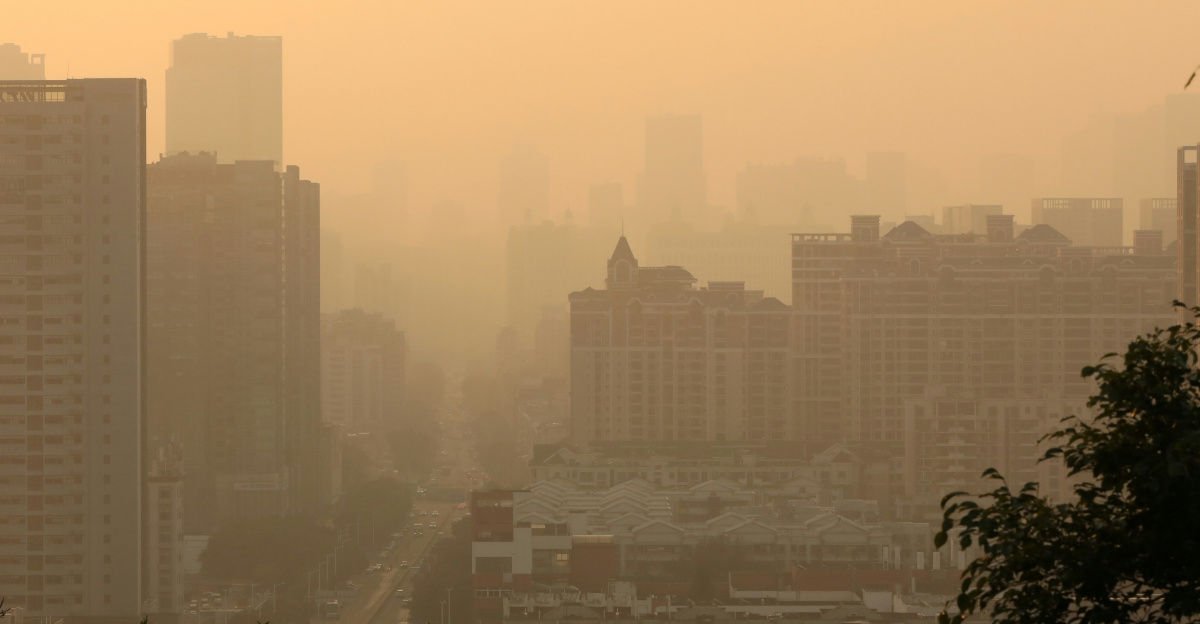 City skyline shrouded in hazy, warm light.