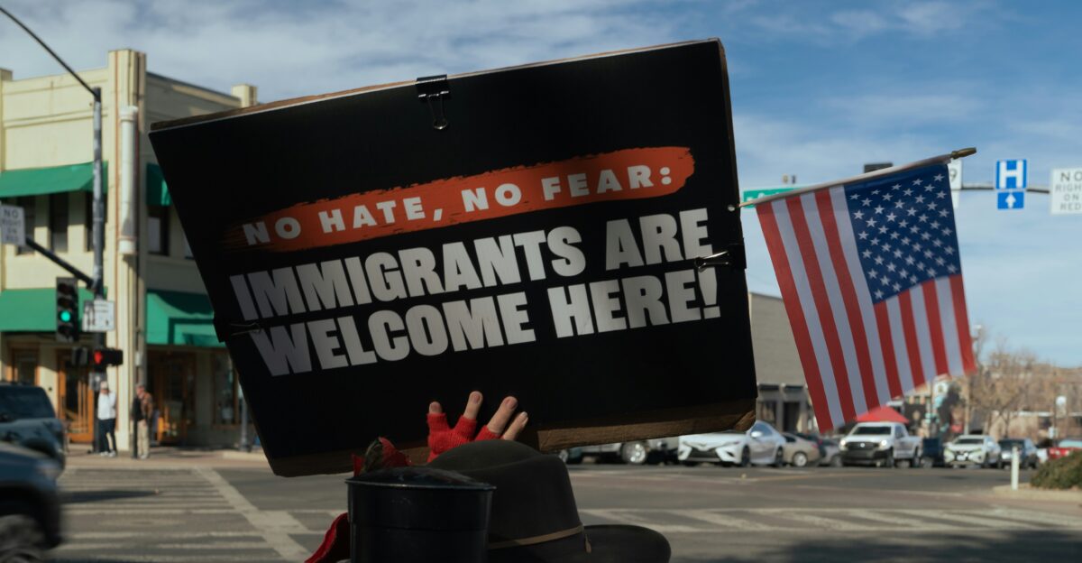 Protest sign reads immigrants are welcome here