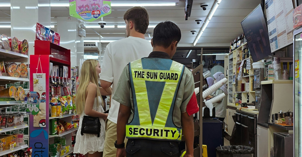 Security guard in a store with customers