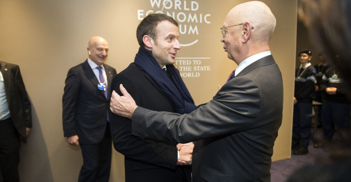 Klaus Schwab the chairman of WEF welcomes the french president Emmanuel Macron YGL Speakers room Annual Meeting 2018 of the World Economic Forum in Davos January 24 2018 Copyright by World Economic Forum Pierre Abensur