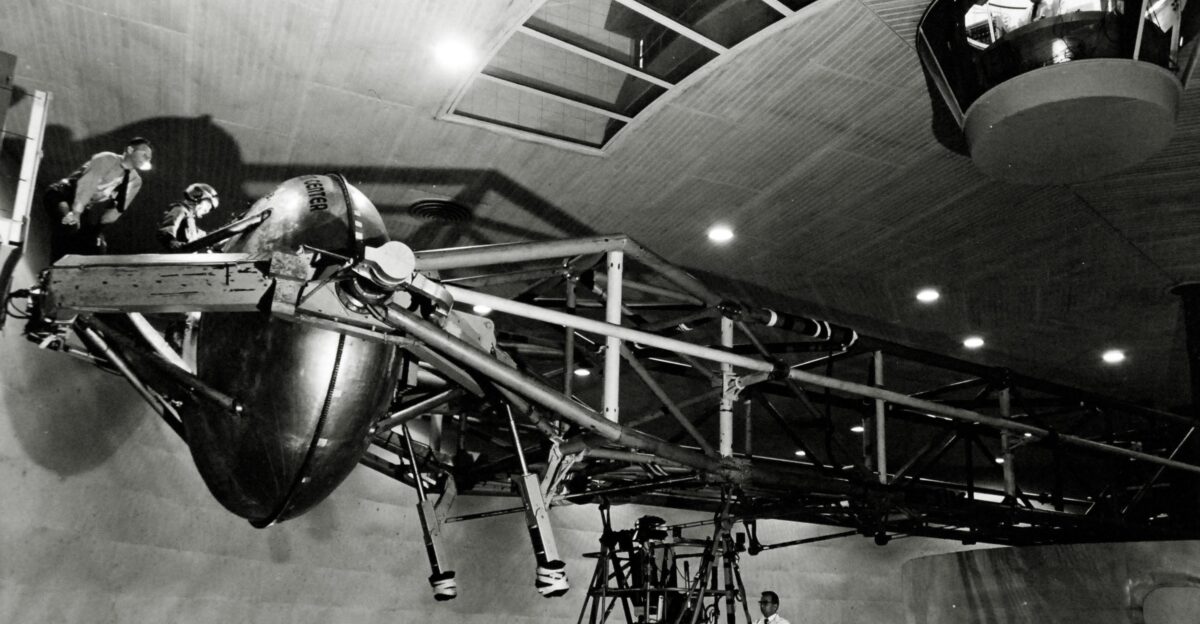 PS-9019 USN 1036457 The giant motor arm of the human centrifuge At left the pilot prepares to enter the gondola At upper right control space is attached to the ceiling of the centrifuge room July 7 1958 12 02 2014