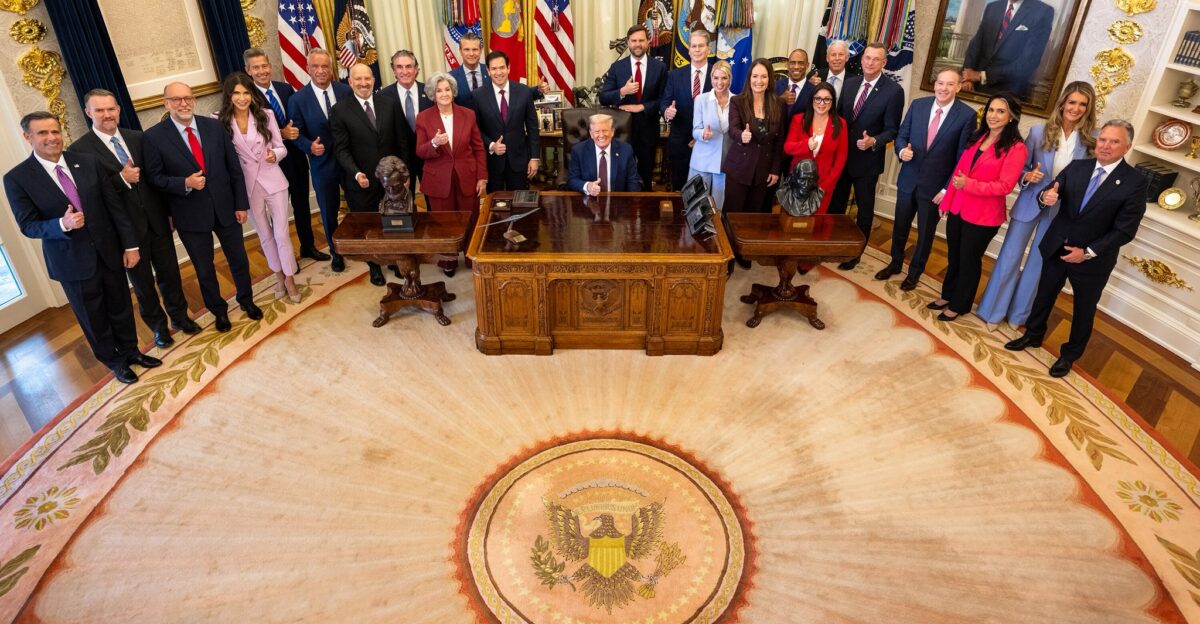 The second cabinet of Donald Trump pose for a picture in the Oval Office