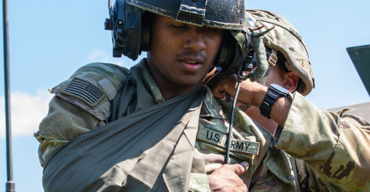A U.S. Soldier assigned to 1st Battalion, 77th Field Artillery Regiment, 41st Field Artillery Brigade creates a sling for a Soldier acting as simulated casualty after an oppositional forces attack during Saber Guardian 25, Cincu Training Area, Romania, June 15, 2025. The training scenario tested the unit’s emergency response, coordination, and casualty evacuation procedures under high-pressure conditions, ensuring readiness for real-world combat and humanitarian missions. (U.S. Army photo by Spc. Hunter Carpenter)
Demonstrating global deterrence and the U.S. Army’s ability to rapidly deploy U.S.-based combat power in Europe and the Arctic region alongside Allies and partners, DEFENDER 25 brings U.S. troops together with forces from 29 Allied and partner nations to build readiness through large-scale combat training from May 11-June 24, 2025. DEFENDER 25 increases the lethality of the NATO alliance through large-scale tactical training maneuvers and long-range fires, builds unit readiness in a complex joint, multinational environment and leverages host nation capabilities to increase the U.S. Army’s operational reach. During three large-scale combat training exercises—Swift Response, Immediate Response, and Saber Guardian—Ally and partner forces integrate and expand multi-domain operations capability, demonstrating combined command and control structures and readiness to respond to crisis and conflict.