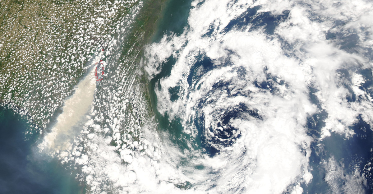 Subtropical Storm Andrea had weakened into a subtropical depression off the Florida coast when this image was taken by NASA s Aqua Satellite on May 10 2007 The smoke plume from a major fire near the Florida Georgia border is also visible in this image