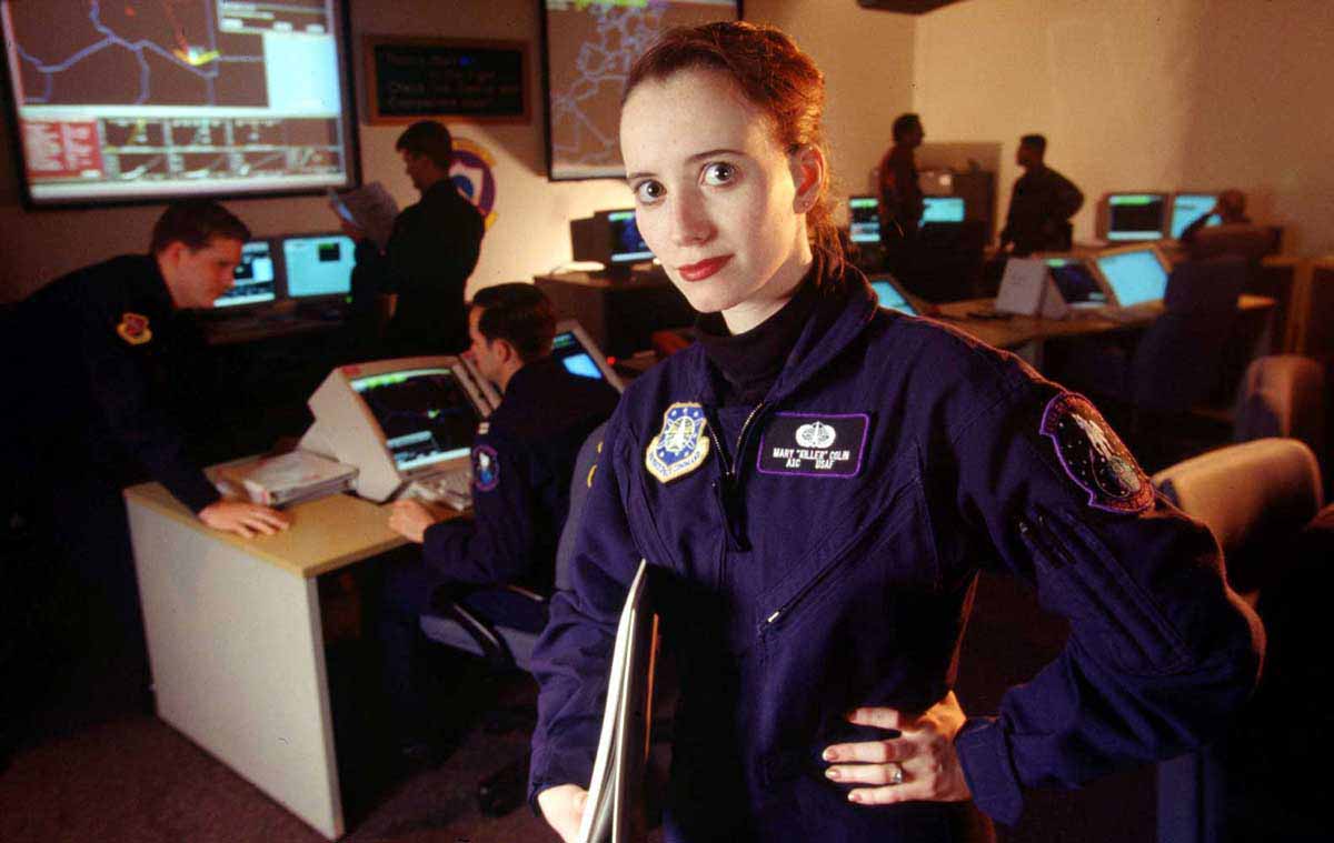 Satellite Data Systems Operator Airman 1st Class Mary Colin belongs to the 11th Space Warning Squadron at Schriever Air Force Base Colo The Operations center in the photo is at the 11th SWS and operates the Attack Launch Early Reporting to Theater ALERT missile warning system U S Air Force Photo by Tech Sgt Scott Wagers