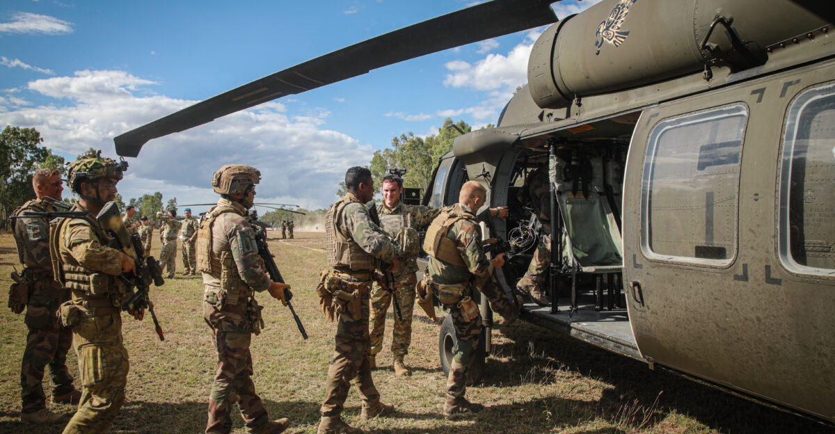 Soldiers assigned to the French Armed Forces load into an UH-60 Black Hawk assigned to 16th Combat Aviation Brigade Task Force Warhawk Battle Group Griffin during hot cold load training given by Spc Jason Worley 16th CAB TF Warhawk BG Griffin as part of Exercise Talisman Sabre in an ADF training area outside of Townsville Queensland Australia July 22 2023 Talisman Sabre is the largest bilateral military exercise between Australia and the United States advancing a free and open Indo-Pacific by strengthening relationships and interoperability among key allies and enhancing our collective capabilities to respond to a wide array of potential security concerns U S Army photo by Sgt Ashunteia Smith 16th Combat Aviation Brigade