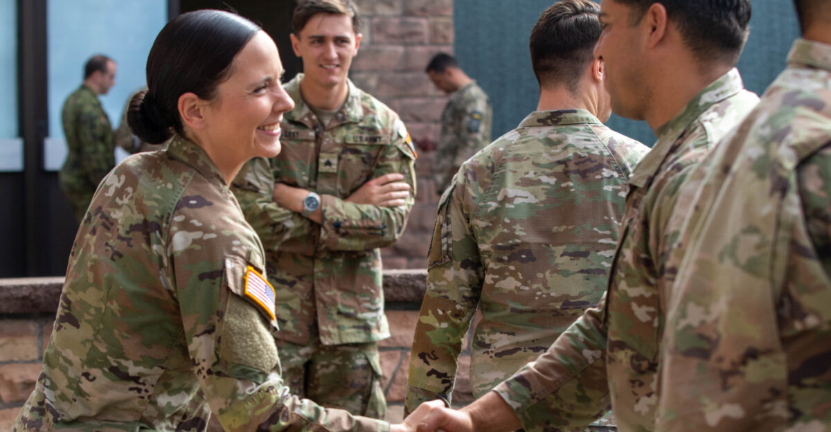 Sgt Bethany Hall an all-source intel analyst with Charlie Company 519th Intelligence and Electronic Warfare Battalion 525th Expeditionary Military Intelligence Brigade shakes hands during her promotion ceremony on Sept 1 2022 in Wiesbaden Germany Hall is currently deployed in Europe with individuals from XVIII Airborne Corps in order to assure NATO allies and deter Russian aggression
