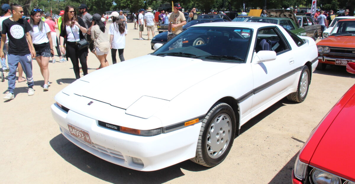 The Supra was derived from the Celica but it was longer and wider the first 4 generations got a 6 cyl engine standard Celicas were 4 cyl The Supra was built from 1978-2002 from 1986 the Celica name was dropped now just Toyota Supra The first generation was the A40 built from 1978-81 based on the Celica Liftback but 5 inches longer The second generation was the A60 built from 1981-86 similar to the Celica but with pop up headlights again longer The third generation was the A70 built from 1986-93 now completely different to the Celica the Celica now front wheel drive the Supra still rear wheel drive Turbocharged version of the new 2965cc 6 cyl added in 1987 now 231hp 1989 saw a facelift with changes to lower grille mirrors foglights and interior