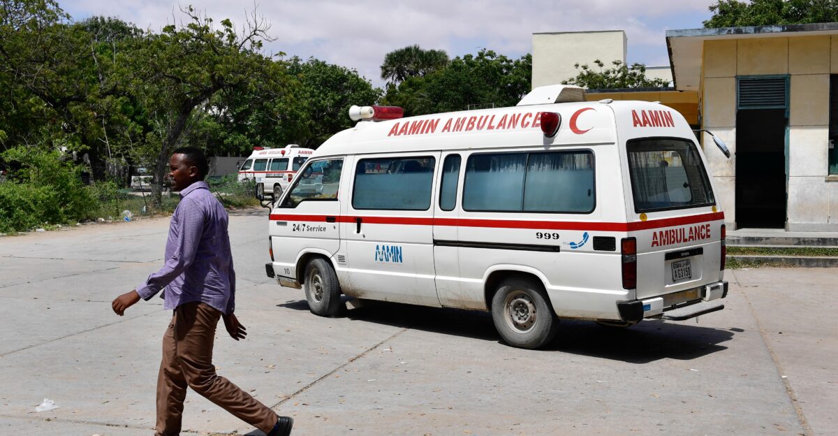 10 28 Aamin Ambulance-2 A man walks past an Aamin Ambulance vehicle inside Benadir Hospital in Mogadishu Somalia on 28 October 2017 UN Photo Ilyas Ahmed