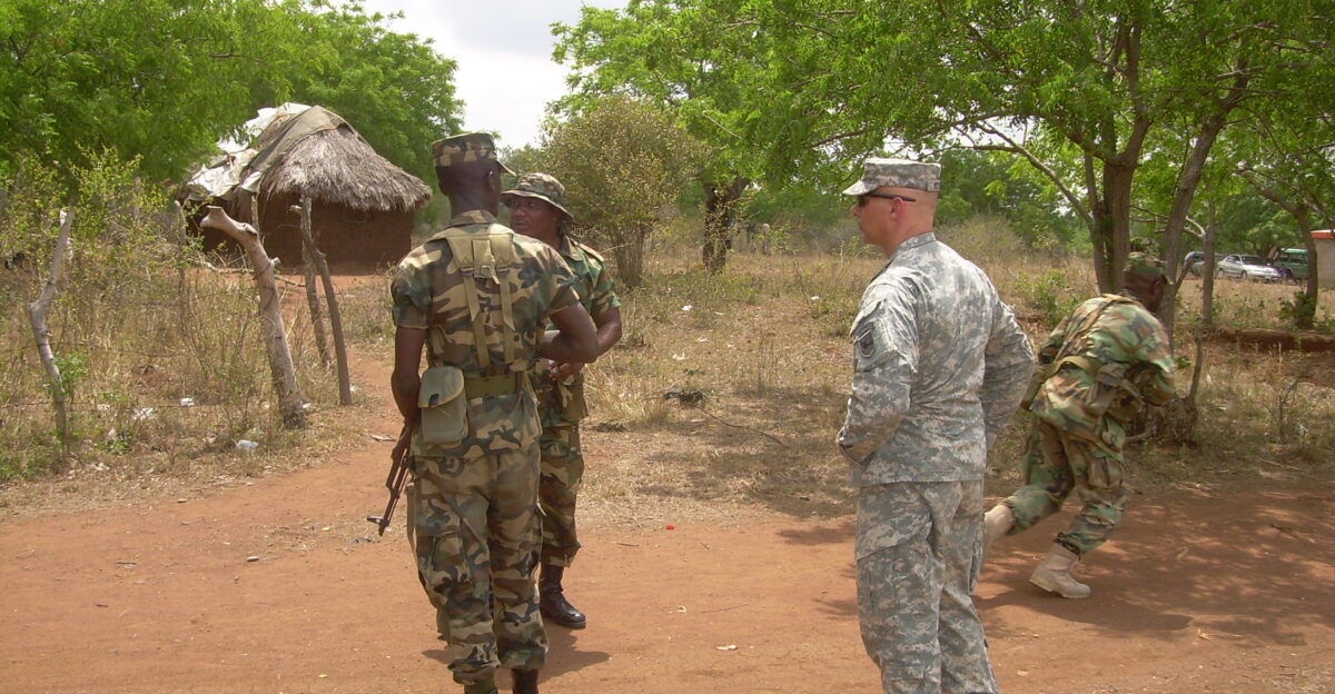 U S Army Africa Sgt 1st Class Grady Hyatt assists Ghanaian soldiers during a field exercise Hyatt and 1st Lt Salvatore Buzzurro worked with Ghanaian troops as part of the ongoing Africa Contingency Operations Training and Assistance program known as ACOTA Ghanaian soldiers are preparing for possible deployments with United Nations forces