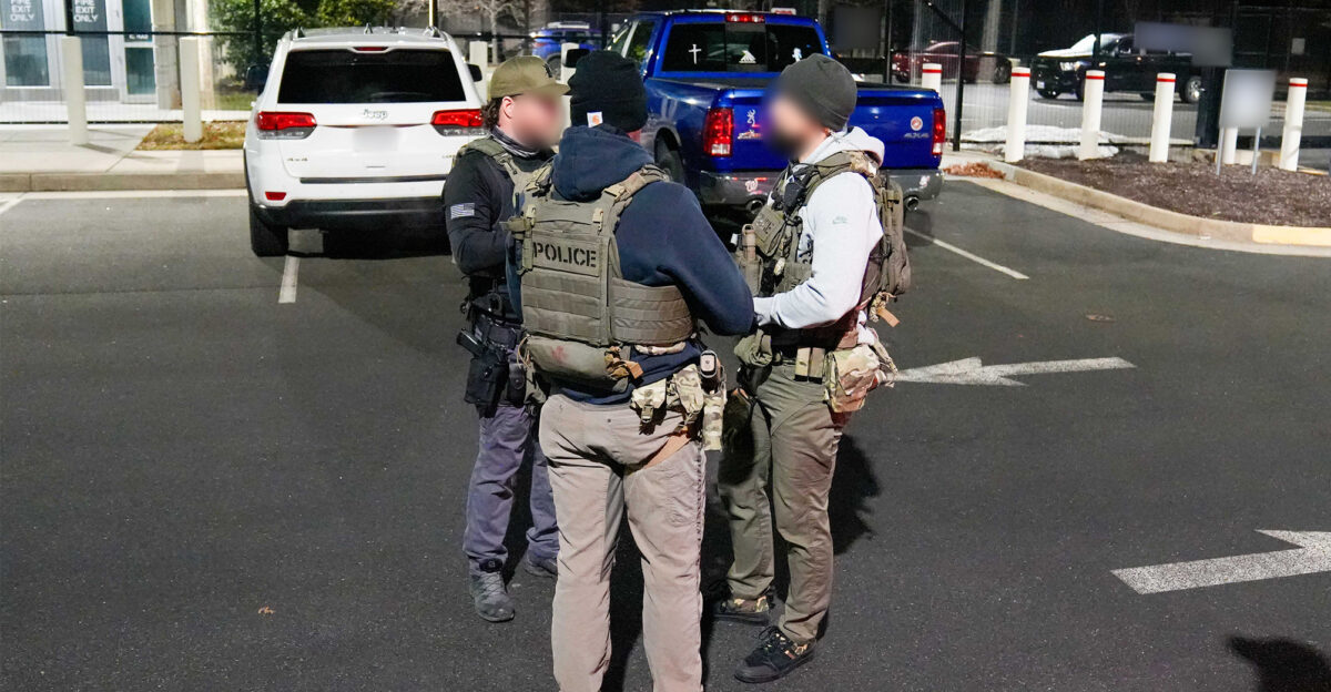 Federal law enforcement officials map out tactical plans before beginning an enhanced immigration enforcement operation near Washington D C Feb 4