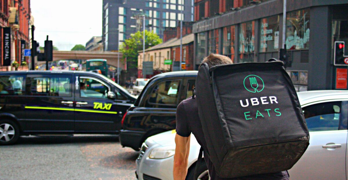 An Uber Eats food delivery driver cycles along a very busy Oxford Road in Manchester One of a growing number of delivery riders for Uber s food delivery service as demand in Manchester increases This photo is released under Creative Commons Use it as you wish I would appreciate attribution in the form of a link to Cheers