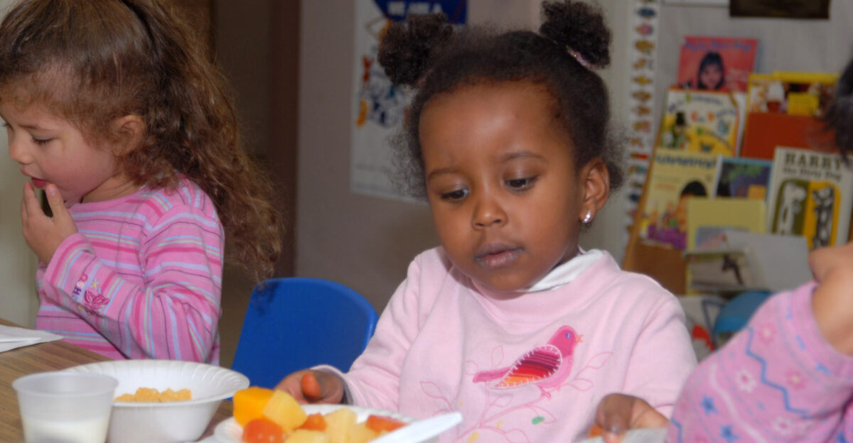Youngsters at the Higher Horizons Day Care Center in Bailey Crossroads VA receive healthy food and snacks on October 25 2006 under the U S Department of Agriculture USDA Food Nutrition Service s FNS Child and Adult Care Food Program CACFP and Head Start program CACFP plays a vital role in improving the quality of day care for children and elderly adults by making care more affordable for many low-income families Each day 3 2 million children receive nutritious meals and snacks through CACFP USDA photo by Ken Hammond