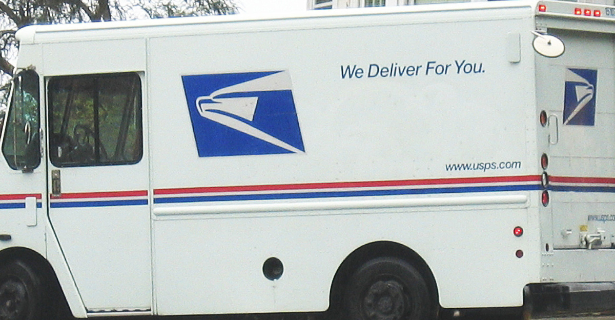 United States Postal Service delivery truck in San Francisco residential area. Location: San Francisco, CA.