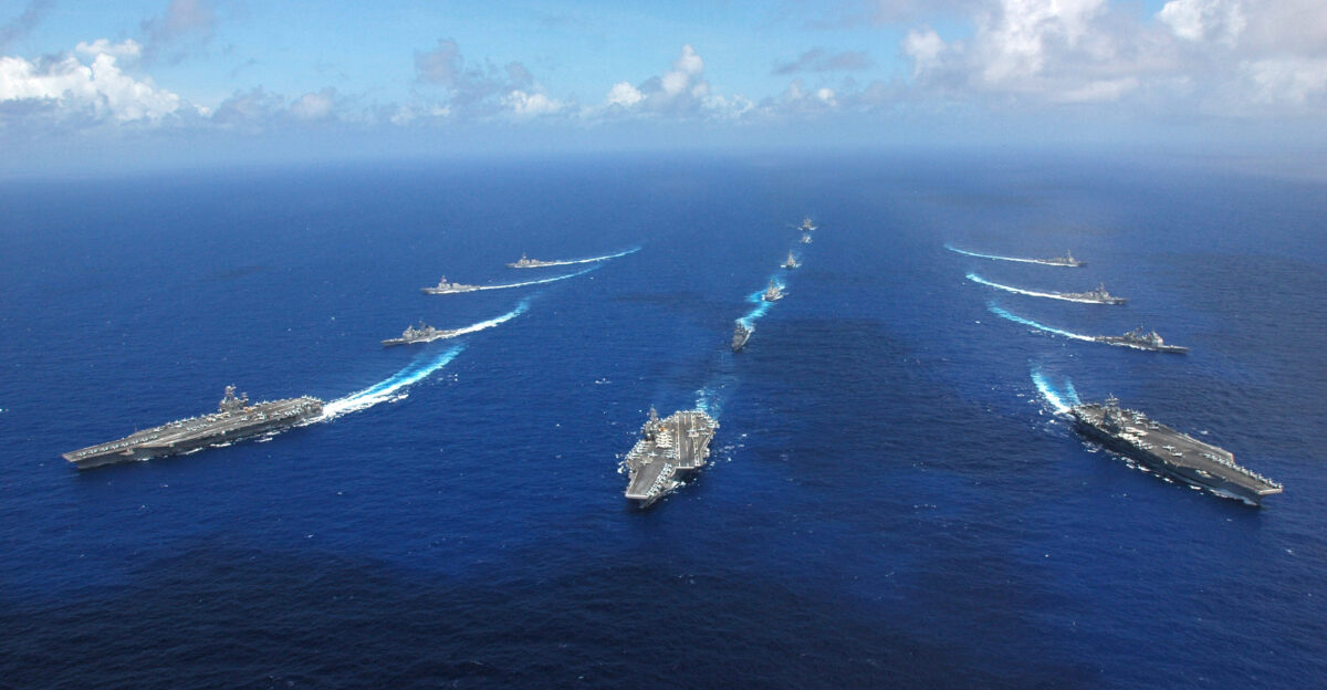 Philippine Sea - Ronald Reagan and Abraham Lincoln Carrier Strike groups break away while the Kitty Hawk Carrier Strike group continues to sail ahead following the photo portion of Exercise Valiant Shield 2006 Valiant Shield focuses on integrated joint training among U S military forces enabling real-world proficiency in sustaining joint forces and in detecting locating tracking and engaging units at sea in the air on land and cyberspace in response to a range of mission areas