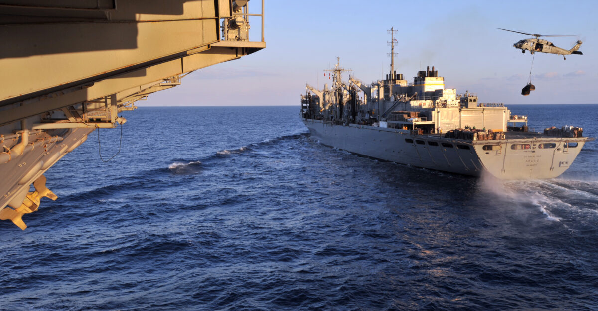 MEDITERRANEAN SEA Feb 13 2011 The Military Sealift Command fast combat support ship USNS Arctic T-AOE 8 transits alongside the aircraft carrier USS Enterprise CVN 65 in preparation of conducting an underway replenishment Enterprise is deployed as part of Enterprise Carrier Strike Group CSG in support of maritime security operations and theater security cooperation efforts in the U S 5th and 6th Fleet areas of responsibility U S Navy photo by Mass Communication Specialist Seaman Jared M King Released