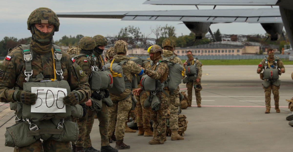 A Polish paratrooper celebrates his 500th airborne jump prior to a multinational airborne jump with Ukrainian paratroopers from 15th Battalion, 95th Air Asault Brigade, U.S. and other Polish paratroopers as part of Rapid Trident 2021 at the International Peacekeeping Security Centre near Yavoriv, Ukraine, Sept. 25, 2021. Rapid Trident is an important step for Ukraine on its path to NATO membership and is designed to increase the efficiency of Ukrainian troops as well as improve the compatibility of the headquarters of the Armed Forces of Ukraine, the United States and other NATO members. (U.S. Army photo by Sgt. Hayden Hallman)
