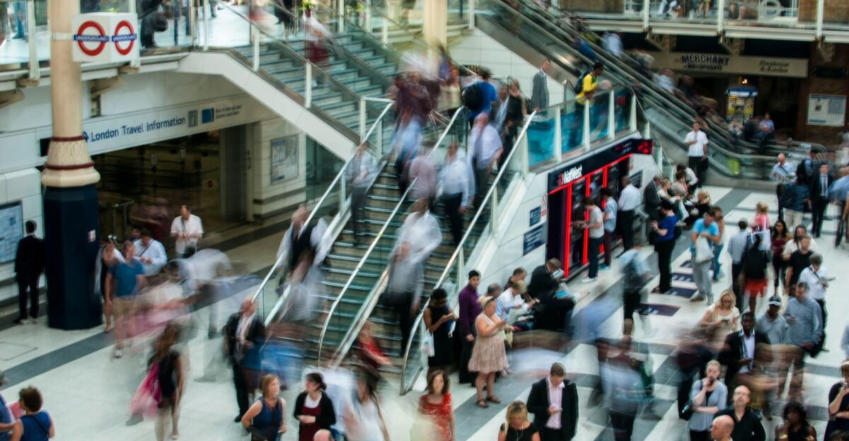 people standing and walking on stairs in mall