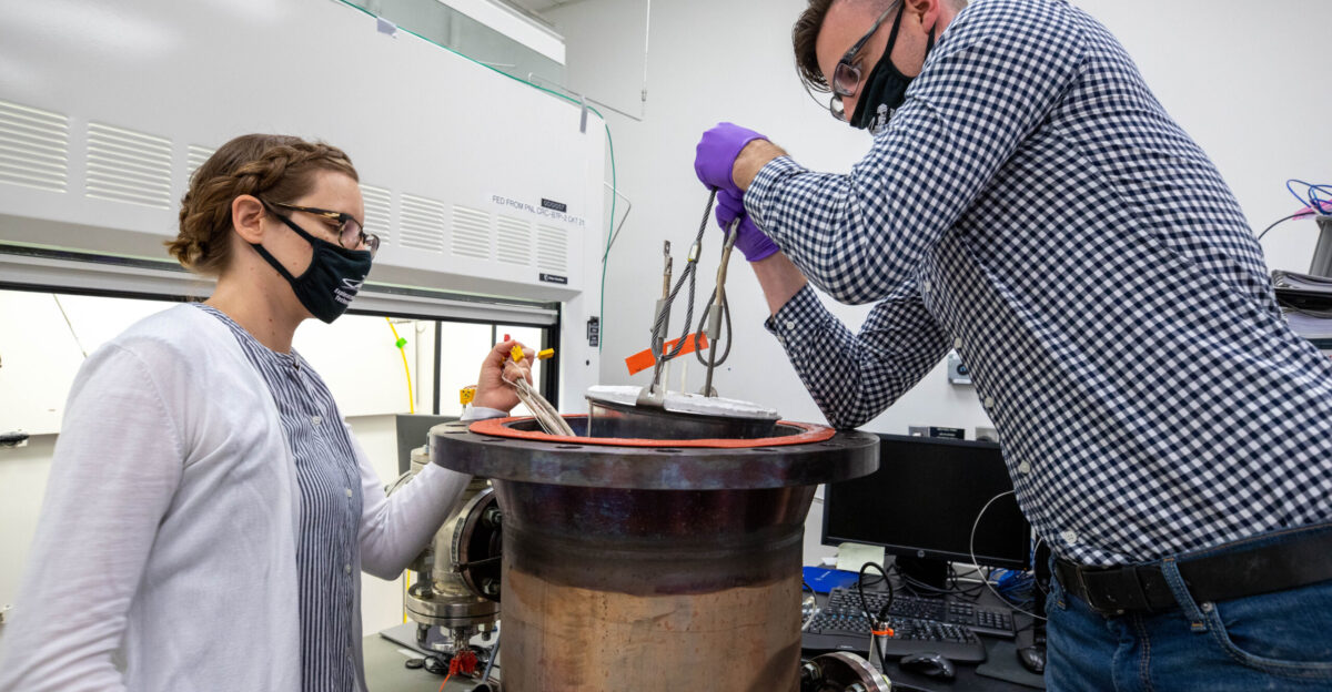 Elspeth Petersen left a chemical engineer and member of the Gaseous Lunar Oxygen from Regolith Electrolysis GaLORE project team and Kevin Grossman GaLORE principal investigator inspect a reactor before a test to melt lunar regolith - dirt and dust on the Moon made from crushed rock - simulants inside a laboratory at Kennedy s Neil Armstrong Operations and Checkout Building on Oct 29 2020 GaLORE was selected as an Early Career Initiative project by the agency s Space Technology Mission directorate and the team was tasked with developing a device that could melt lunar regolith and turn it into oxygen As NASA prepares to land the first woman and the next man on the Moon in 2024 as part of the Artemis program technology such as this can assist with sustainable human lunar exploration and long-duration missions to Mars